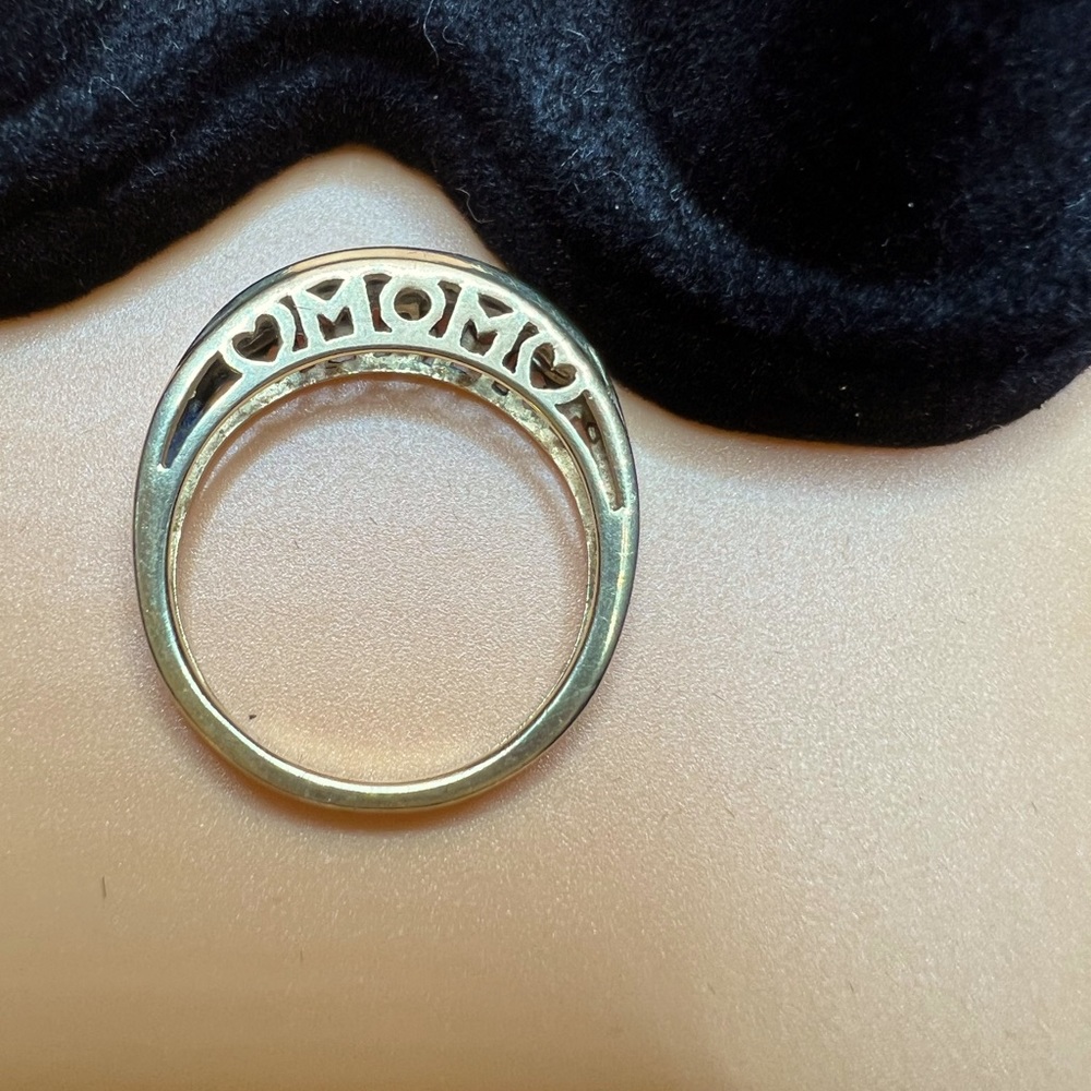 Cute little gold tone ring not marked says mom with two little hearts on it